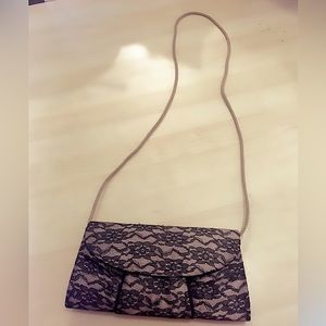 Golden khaki purse with black lace design